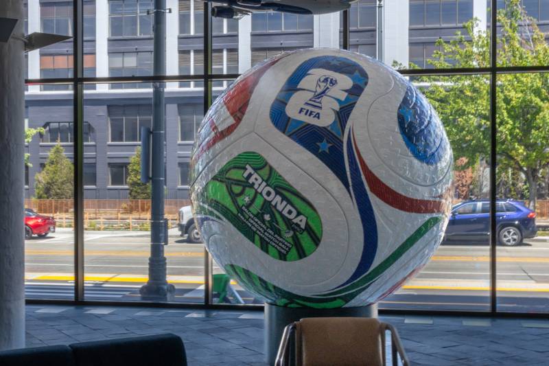 Photo of the region’s largest official match ball, displayed in the public lobby of Port of Seattle headquarters at Pier 69.