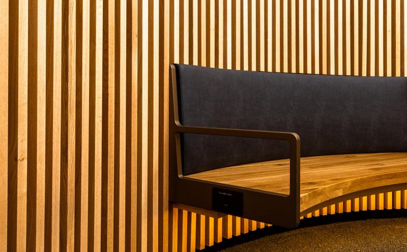 Wooden wall panels and seating in the C Concourse Expansion's Interfaith Prayer and Meditation Room