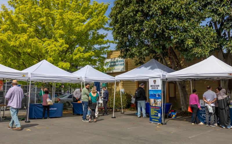 Duwamish River Community Hub Parking Lot with event canopies