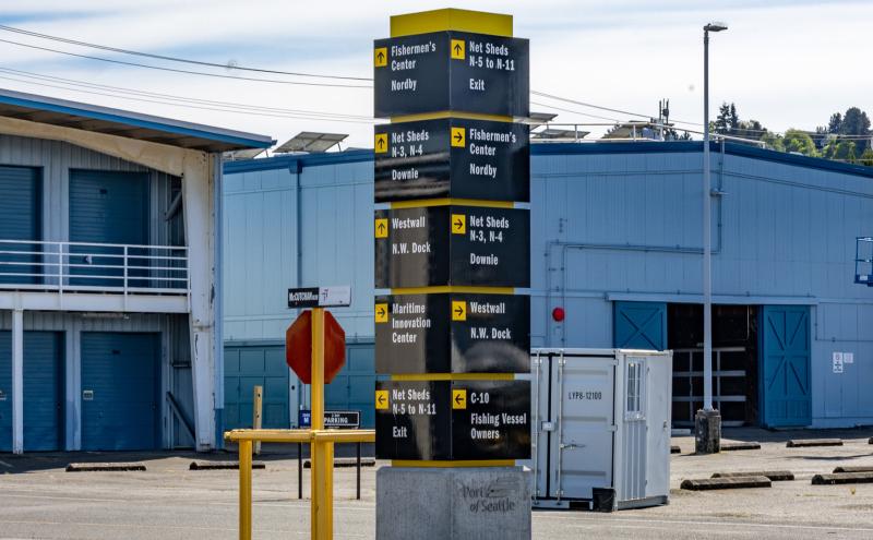 Black and yellow signage at Fishermen's Terminal parking lot.