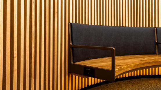 Wooden wall panels and seating in the C Concourse Expansion's Interfaith Prayer and Meditation Room