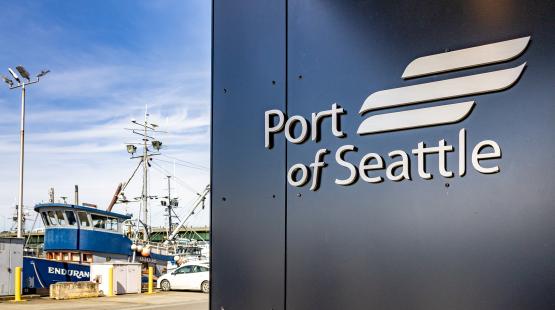 Port of Seattle sign on Maritime Innovation Center overlooking marina.