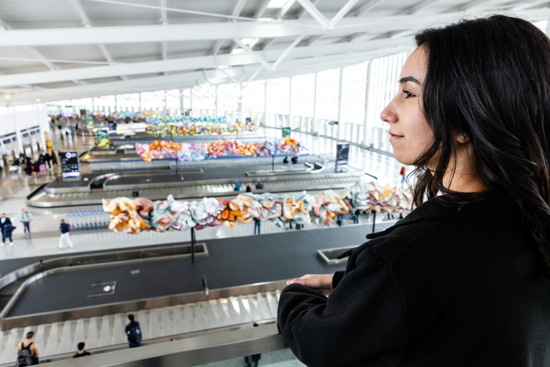 Cilicia Diaz looks out at operations in the International Arrivals Facility.