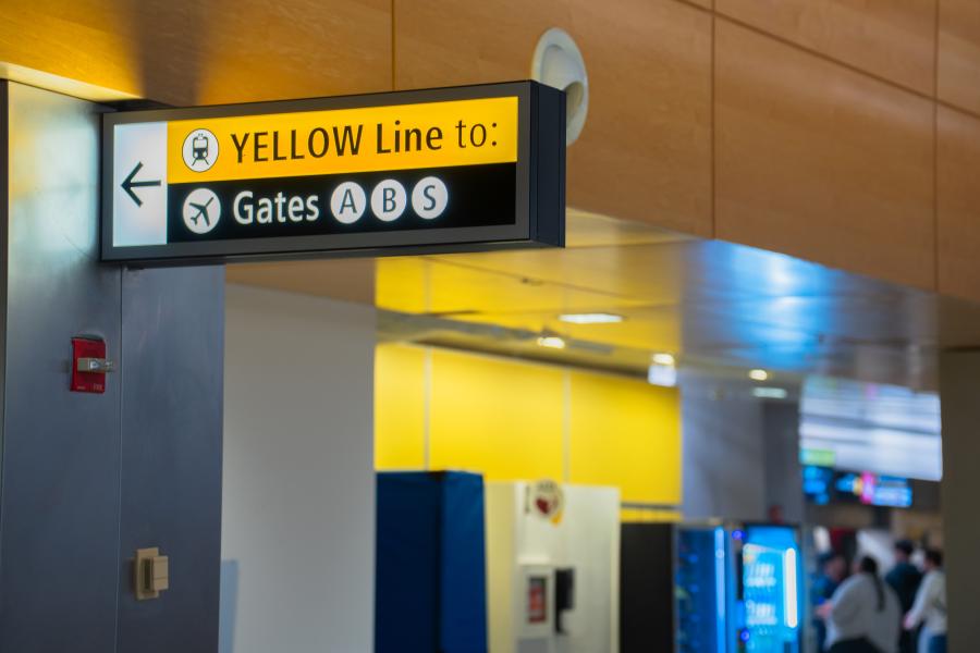 Sign for SEA Underground yellow line to Gates A, B, and S