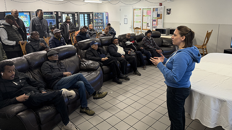 Port staff address SEA taxi drivers at their quarterly meeting.