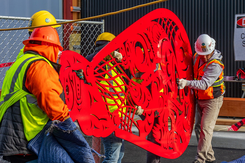 Crew carries "Beach Seining" to prepare for install.