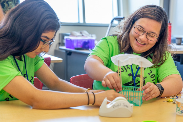 Students building a parachute