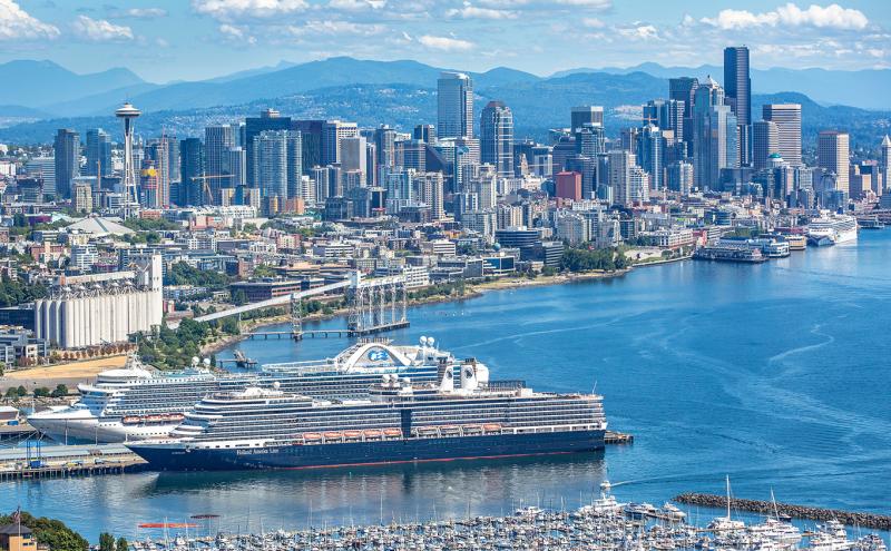 three cruise ships visible from an aerial shot just west of Terminal 91 with sweeping view of Elliott Bay on a clear day Seattle 2017