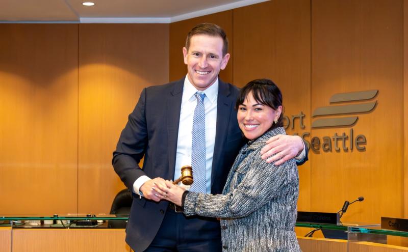 Former Commission President Toshiko Hasegawa passes the gavel to Ryan Calkins, Commission President for 2026