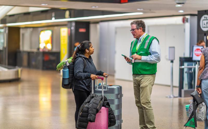 A SEA Ambassador helping a customer 