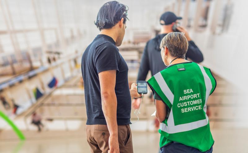 A SEA Ambassador helping a customer 