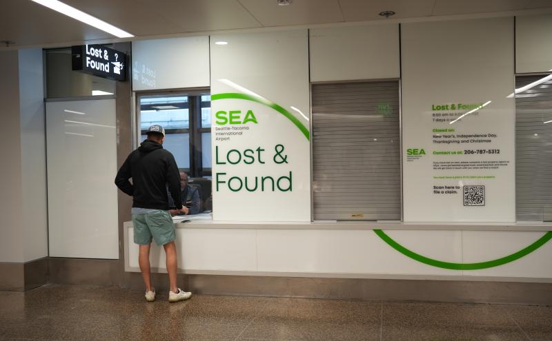 Customer getting help at Lost and Found