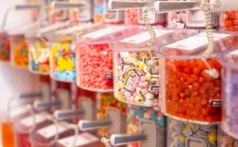 rows of bulk rainbow colored candy