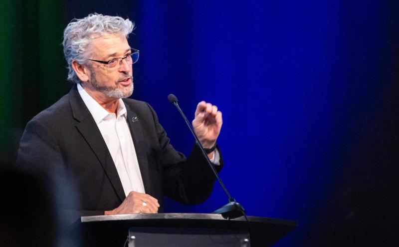 Commissioner Fred Felleman speaking at a podium