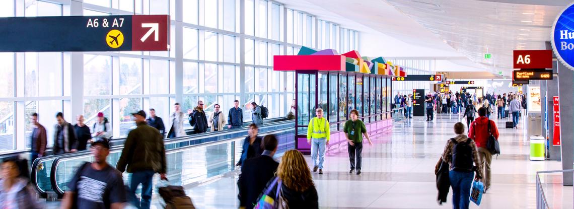 Travelers walk through the terminal.