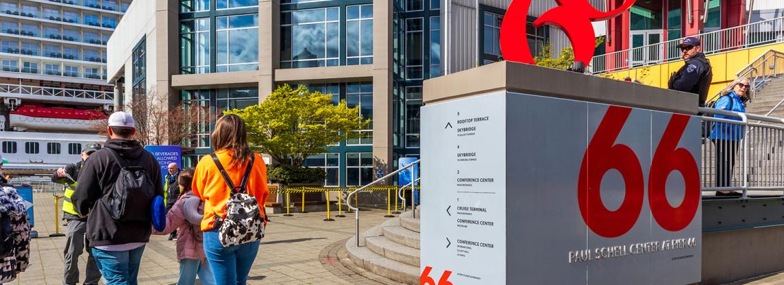 Cruise passengers walk along Pier 66