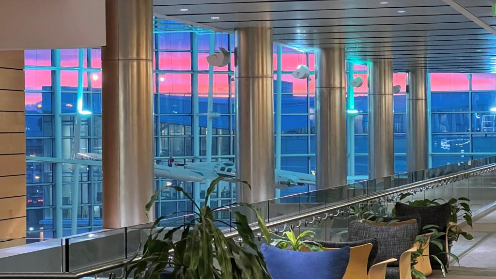 Decorative image of Conference Center hallway with sunrise in the background